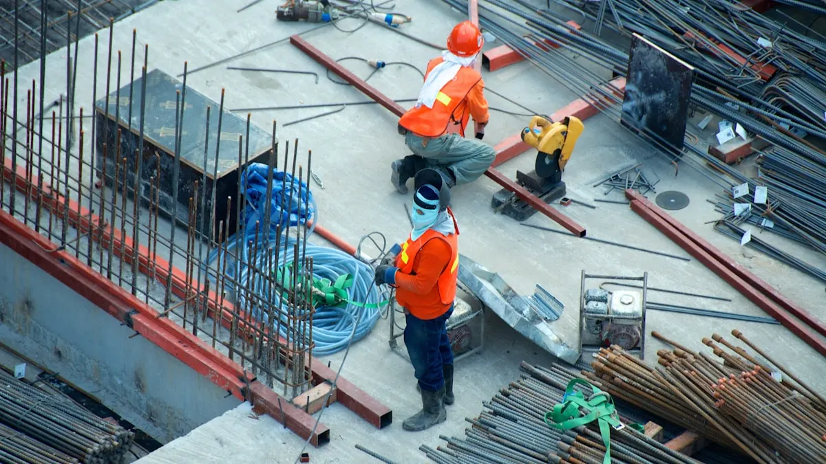 Building construction site with workers and scaffolding